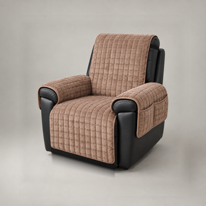 Brown grid quilted recliner cover on a black leather recliner, studio view