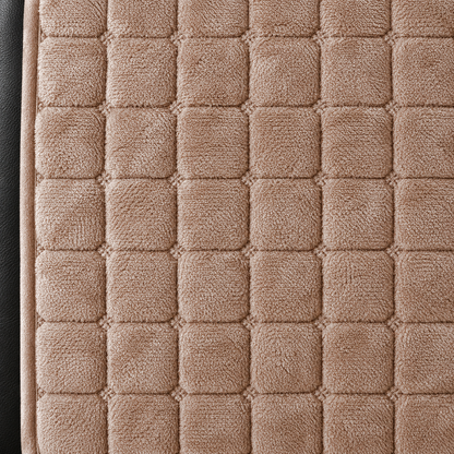 Close-up of the brown grid quilting, with a small stitched knot at each crossing