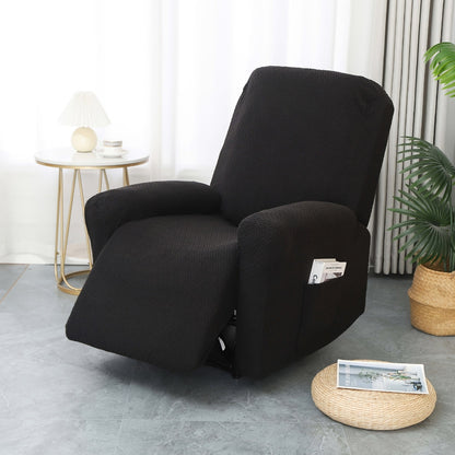 Black stretch jacquard recliner cover on a single recliner with a paperback in the side pocket