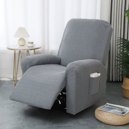 Gray stretch recliner cover with a raised basketweave texture on a recliner with the footrest extended