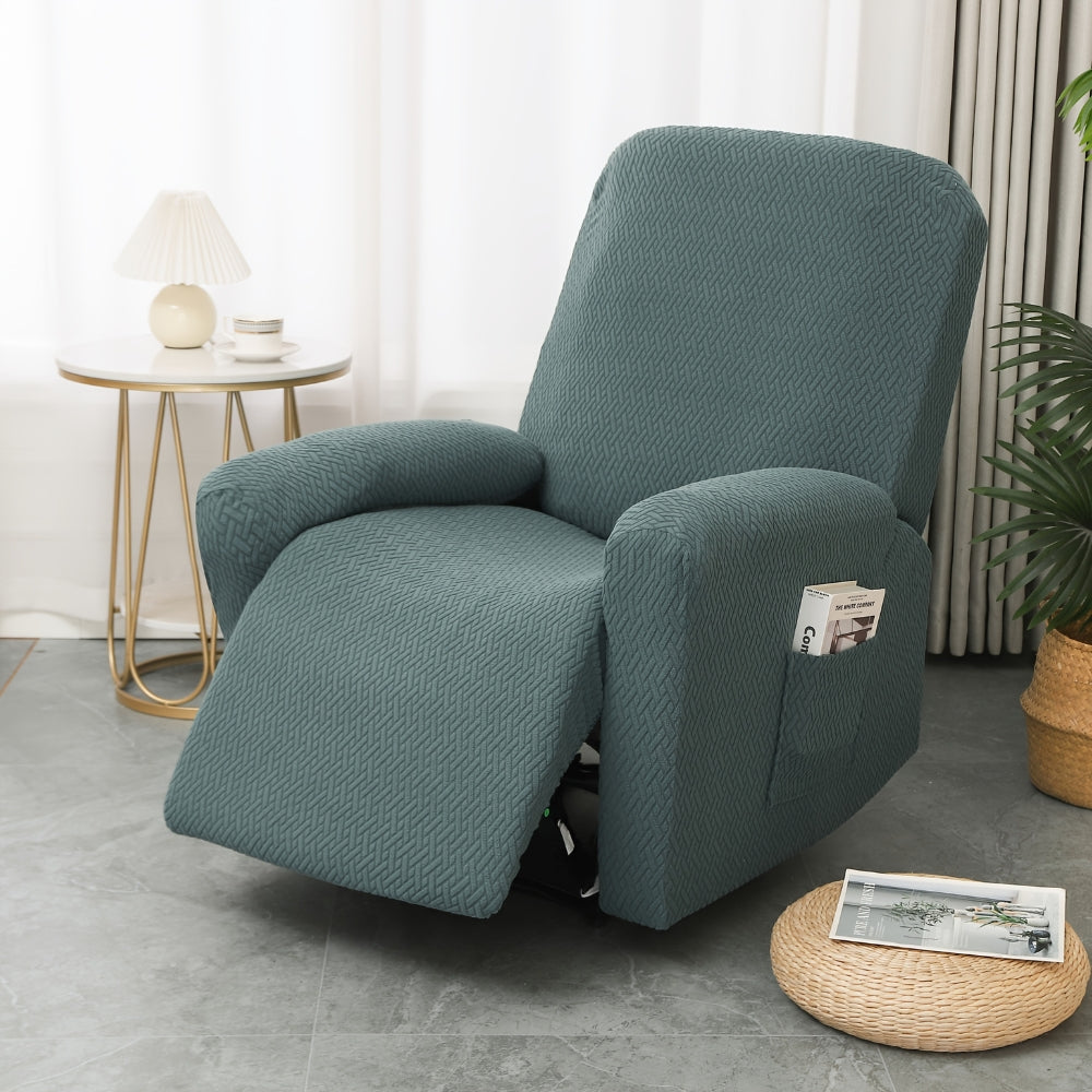 Green stretch recliner cover in four fitted pieces on a recliner, with a book in the pocket on the side of the arm