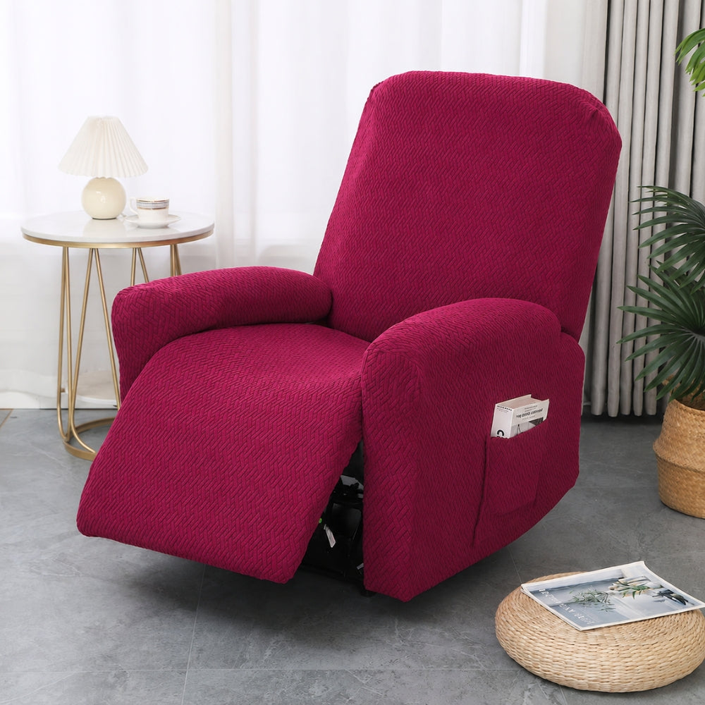 Burgundy stretch recliner cover on a single recliner beside a gold side table and a white lamp