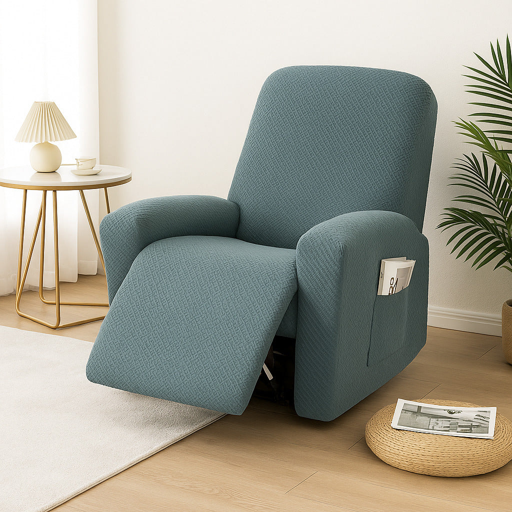 Teal stretch recliner cover on a recliner in a living room with a wood floor and a cream rug