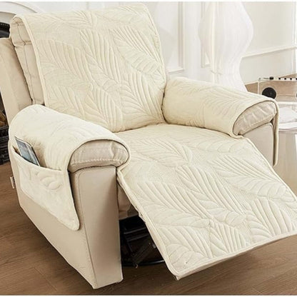 Beige leaf quilted recliner cover on a reclined cream recliner with a pocket on the arm
