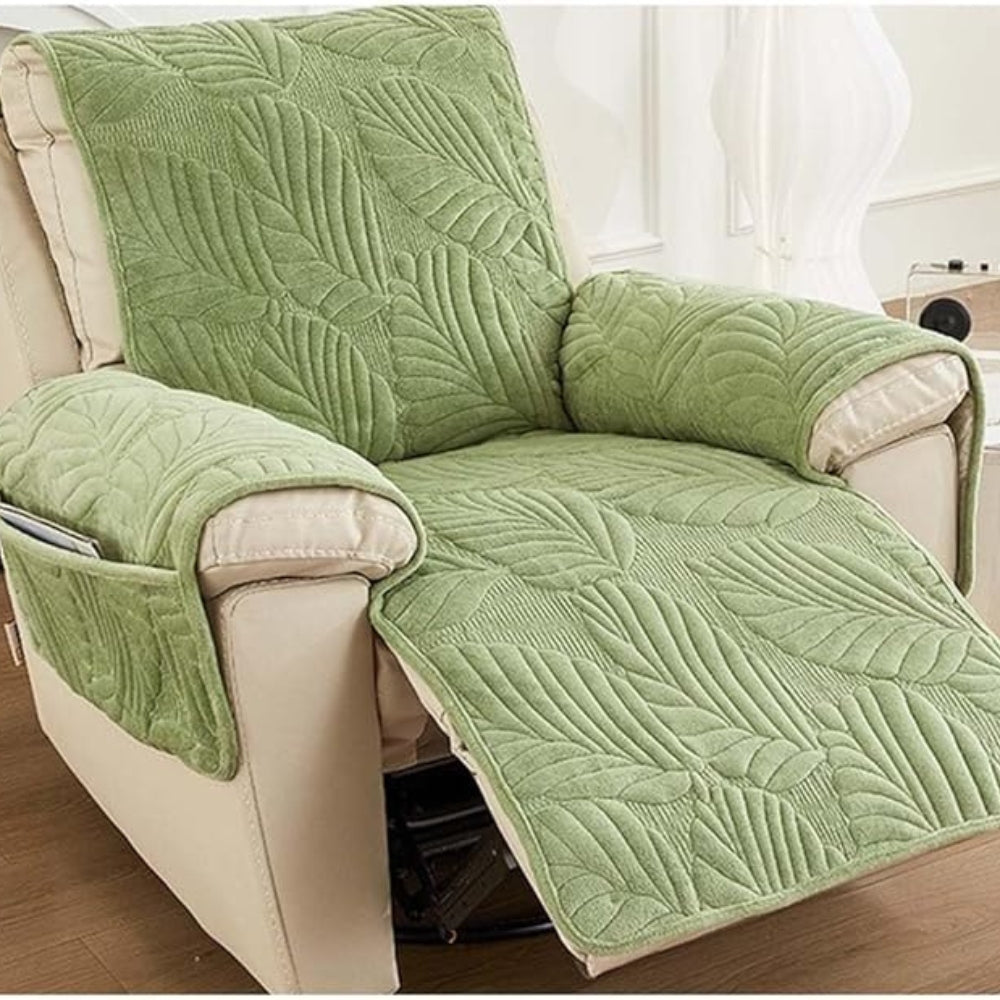 Green leaf quilted recliner cover over the backrest, seat and extended footrest of a recliner