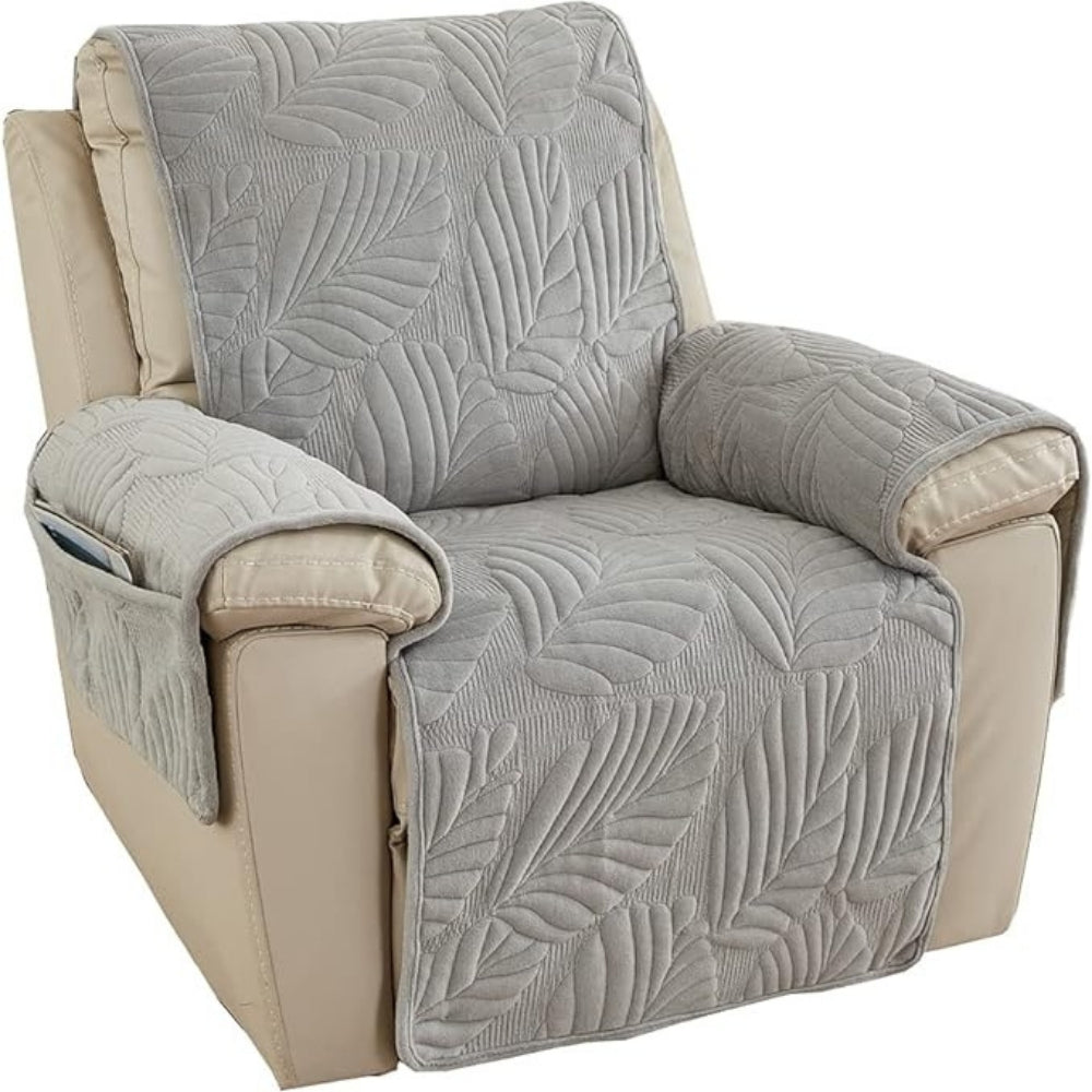 Gray leaf quilted recliner cover on an upright recliner against a white background