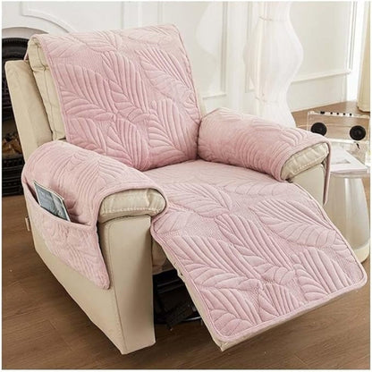 Pink leaf quilted recliner cover on a reclined recliner with a magazine in the side pocket