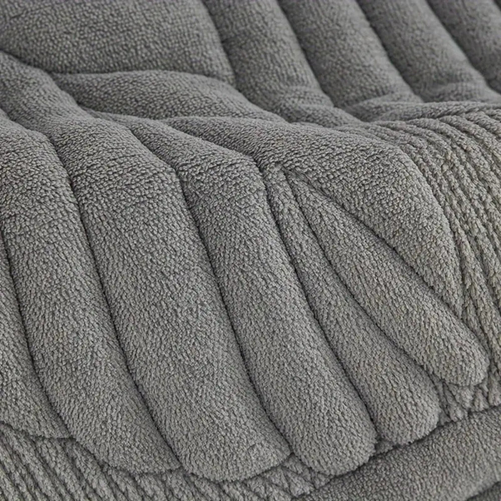 Macro of the soft pile and padded leaf ribs on the charcoal recliner cover