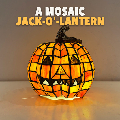 Lit mosaic pumpkin lamp with the words A mosaic jack-o'-lantern