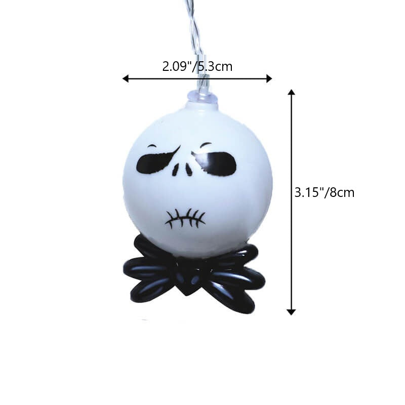 One string light head measuring 2.09 inches (5.3 cm) across and 3.15 inches (8 cm) tall from the cap to the bow tie