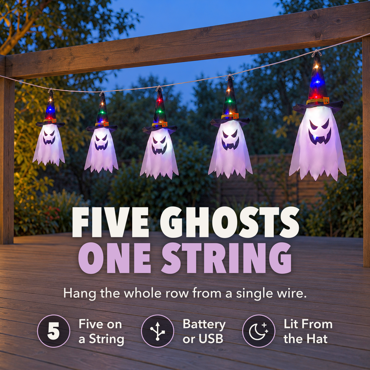 Five glowing witch hat ghost lights hanging from a garden pergola at dusk, with the words Five ghosts, one string