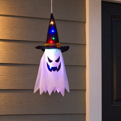 A single witch hat ghost light glowing beside a front door at dusk