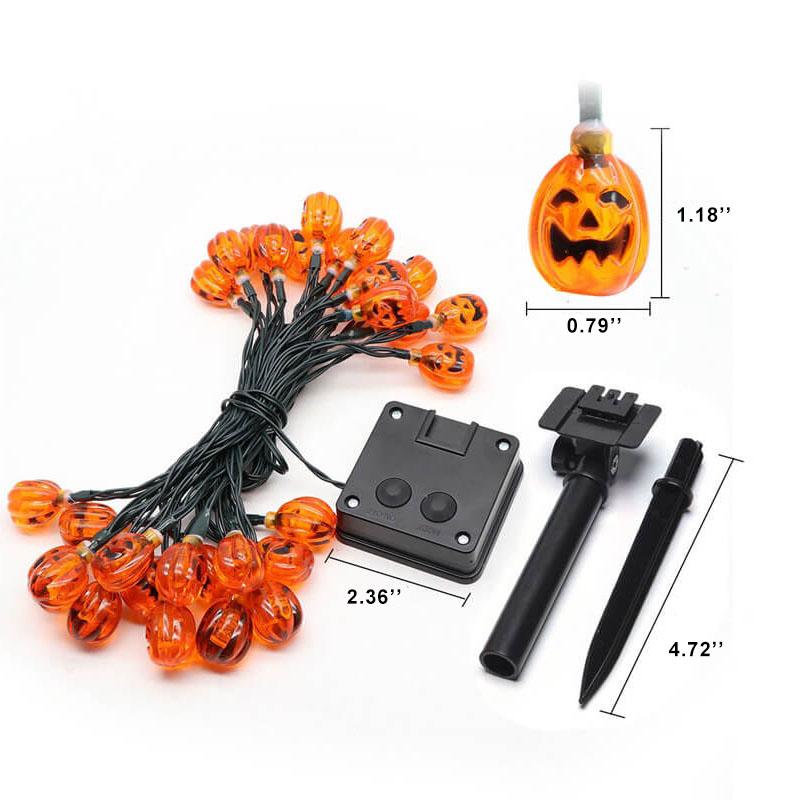 Solar pumpkin string lights on a dark green wire with a black solar panel and a two-part ground stake; each bulb 1.18 by 0.79 inches