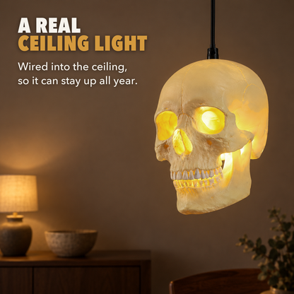 Skull pendant light glowing in a dining room, with the words A real ceiling light