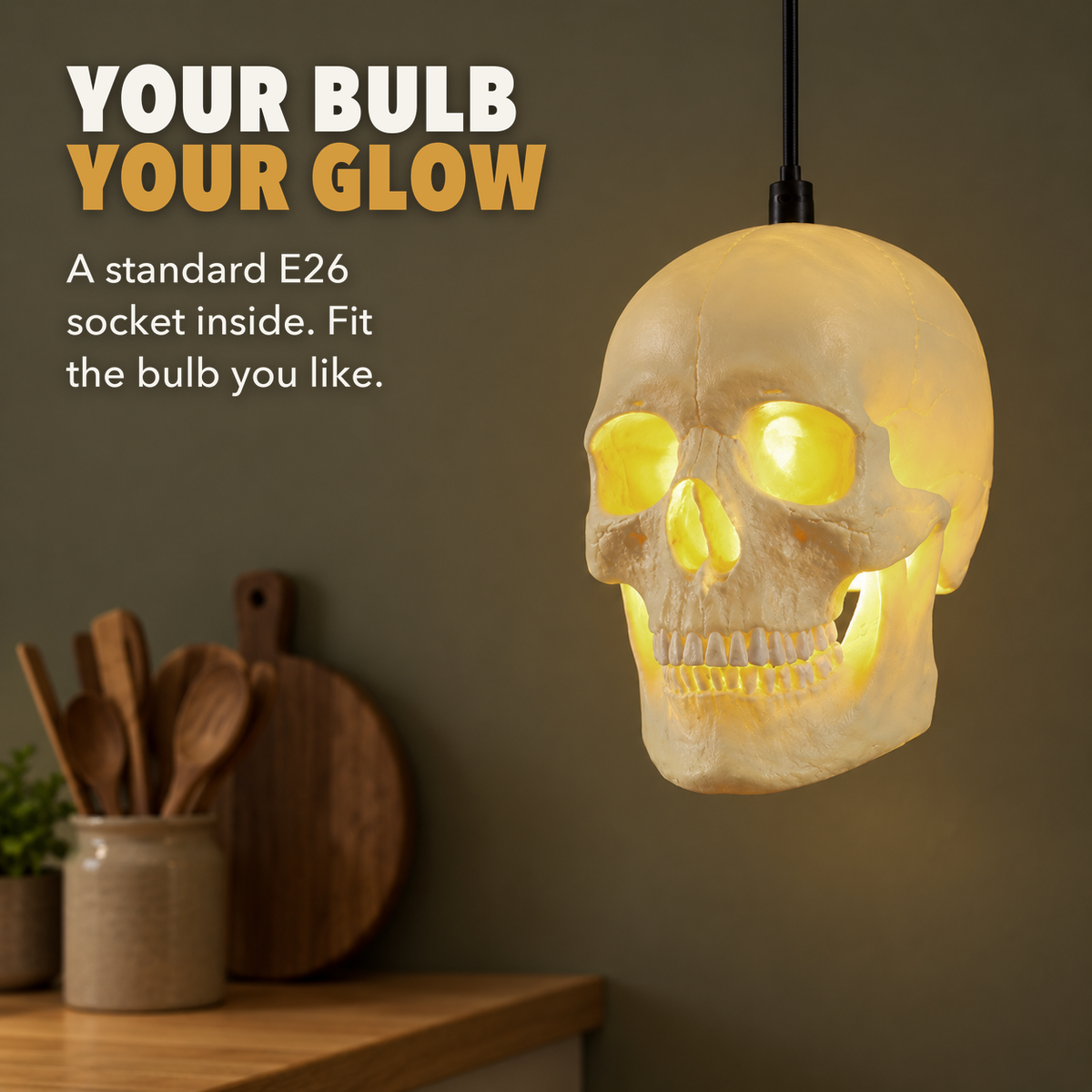 Skull pendant light glowing over a kitchen counter, with the words Your bulb, your glow