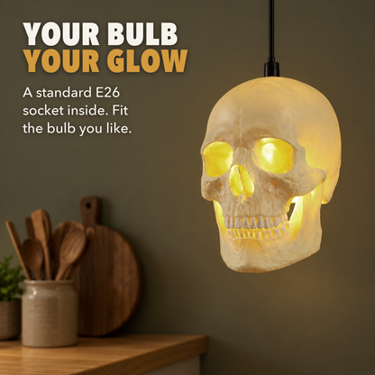 Skull pendant light glowing over a kitchen counter, with the words Your bulb, your glow