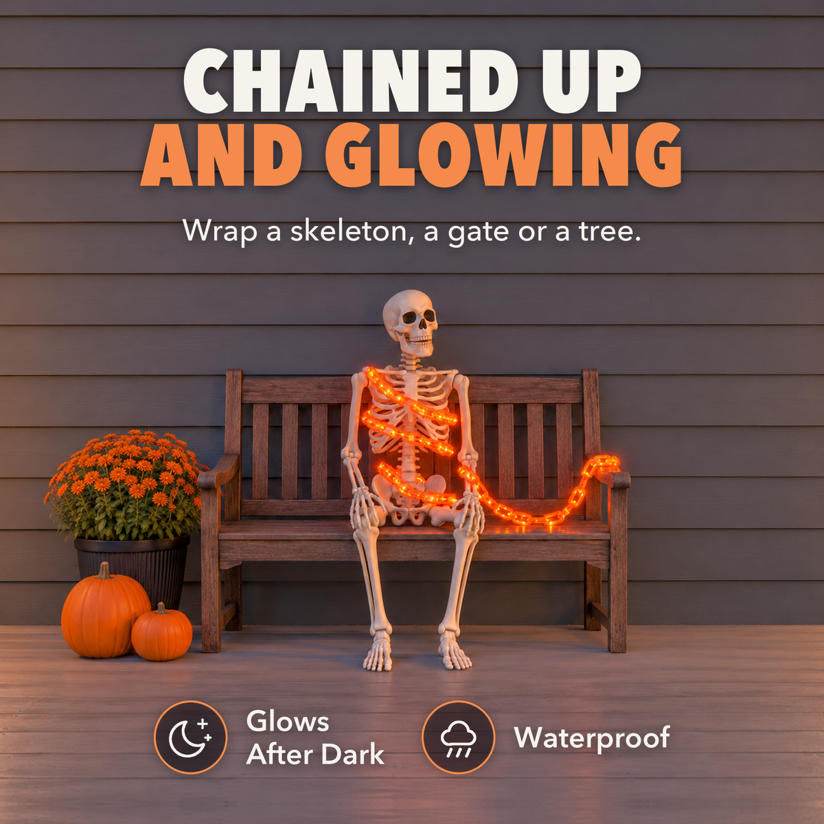 Orange glowing chain light wrapped around a plastic skeleton on a porch bench, with the words Chained up and glowing