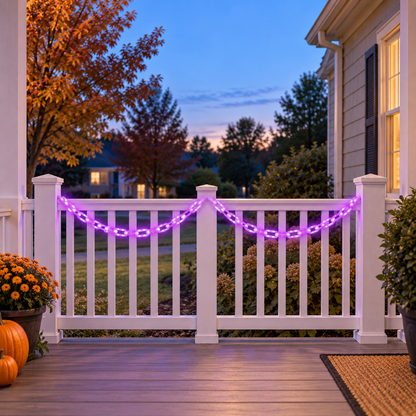 Purple glowing chain lights hanging in two swags along a white porch railing at dusk