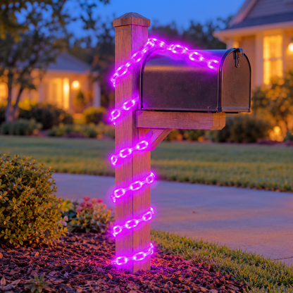 Purple glowing chain lights wound around a mailbox post at the end of a drive at dusk