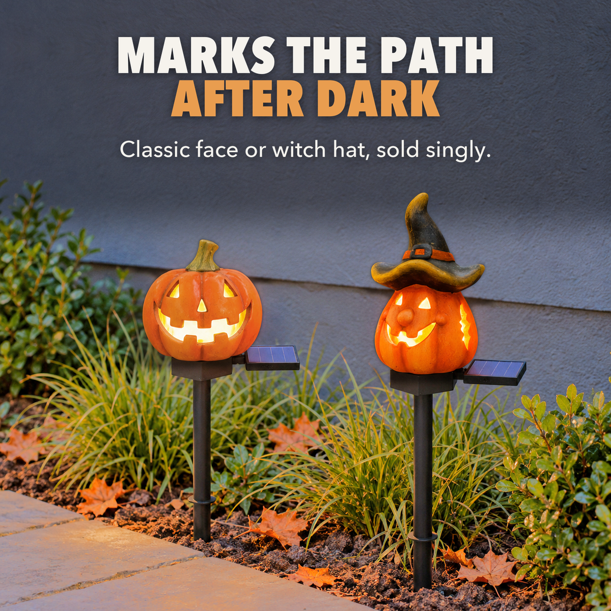 Classic and Witch Hat pumpkin stake lights glowing beside a flagstone path at dusk, with the words Marks the path after dark