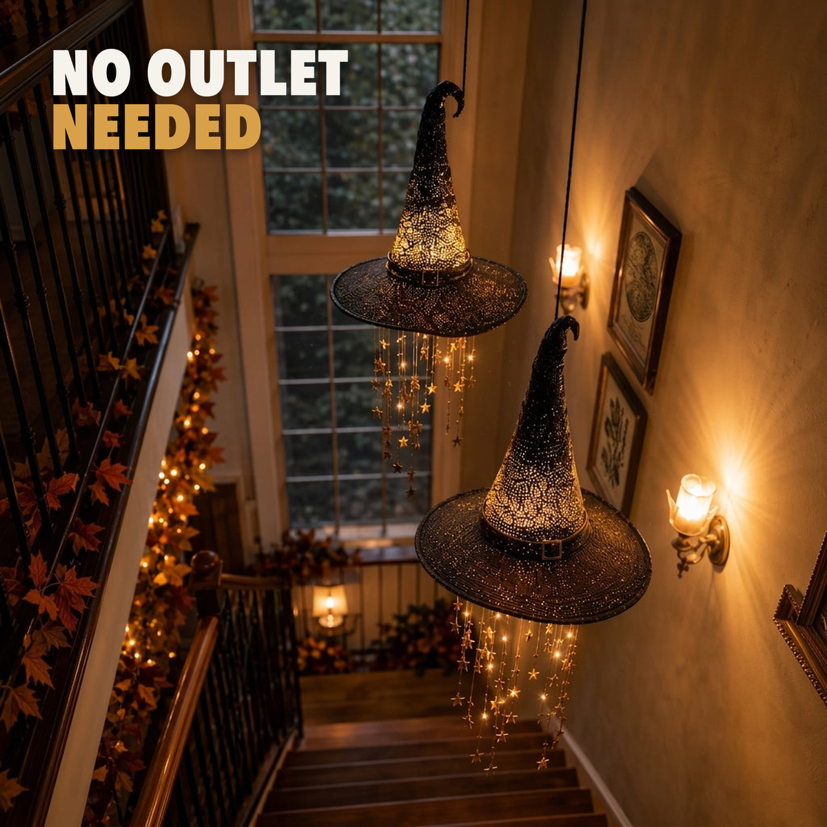 Two witch hat lights hanging in a stairwell with star strands lit, with the words no outlet needed