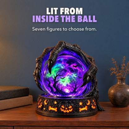 Claw crystal ball lamp glowing purple on a dark bookcase at evening, with the words Lit from inside the ball