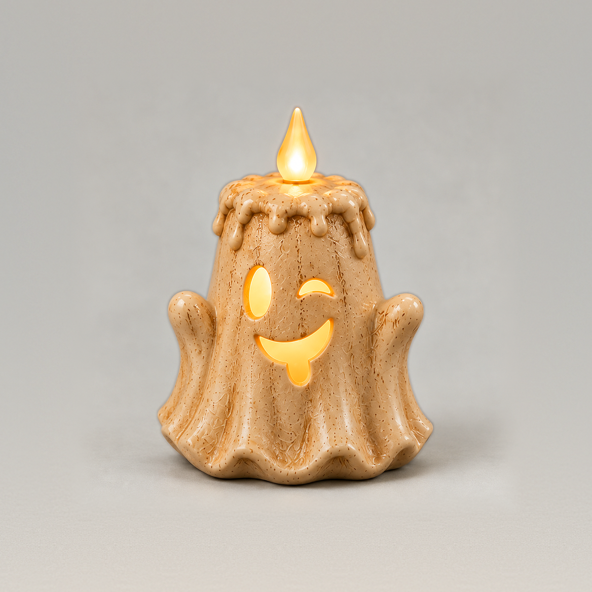 Small winking ghost LED candle with its tongue out, melted wax top and flame, on a plain grey background