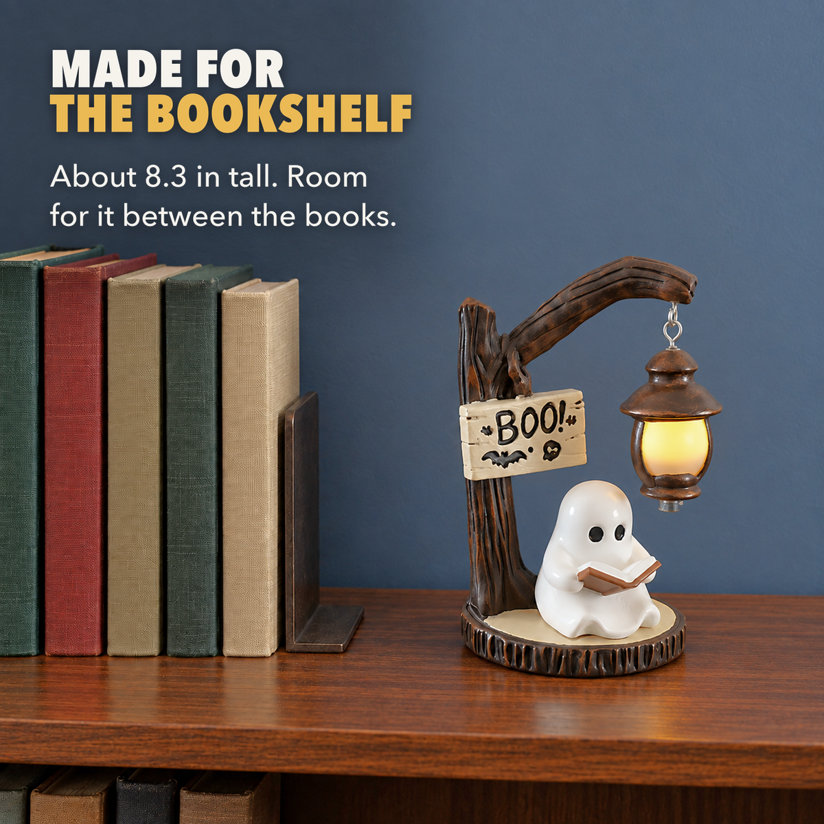 Reading ghost decoration on top of a walnut bookcase beside a row of hardbacks, with the words Made for the bookshelf