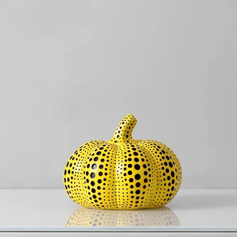 Small Pumpkin polka dot sculpture, a low ribbed yellow pumpkin with a curved stem and black dots, 5.5 inches wide