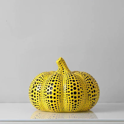 Large Pumpkin polka dot sculpture, a wide ribbed yellow pumpkin covered in black dots, 7.9 inches wide