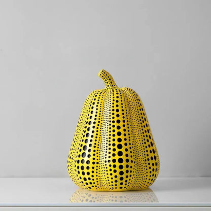Large Pear polka dot sculpture, a tall ribbed yellow gourd covered in black dots, 8.1 inches tall