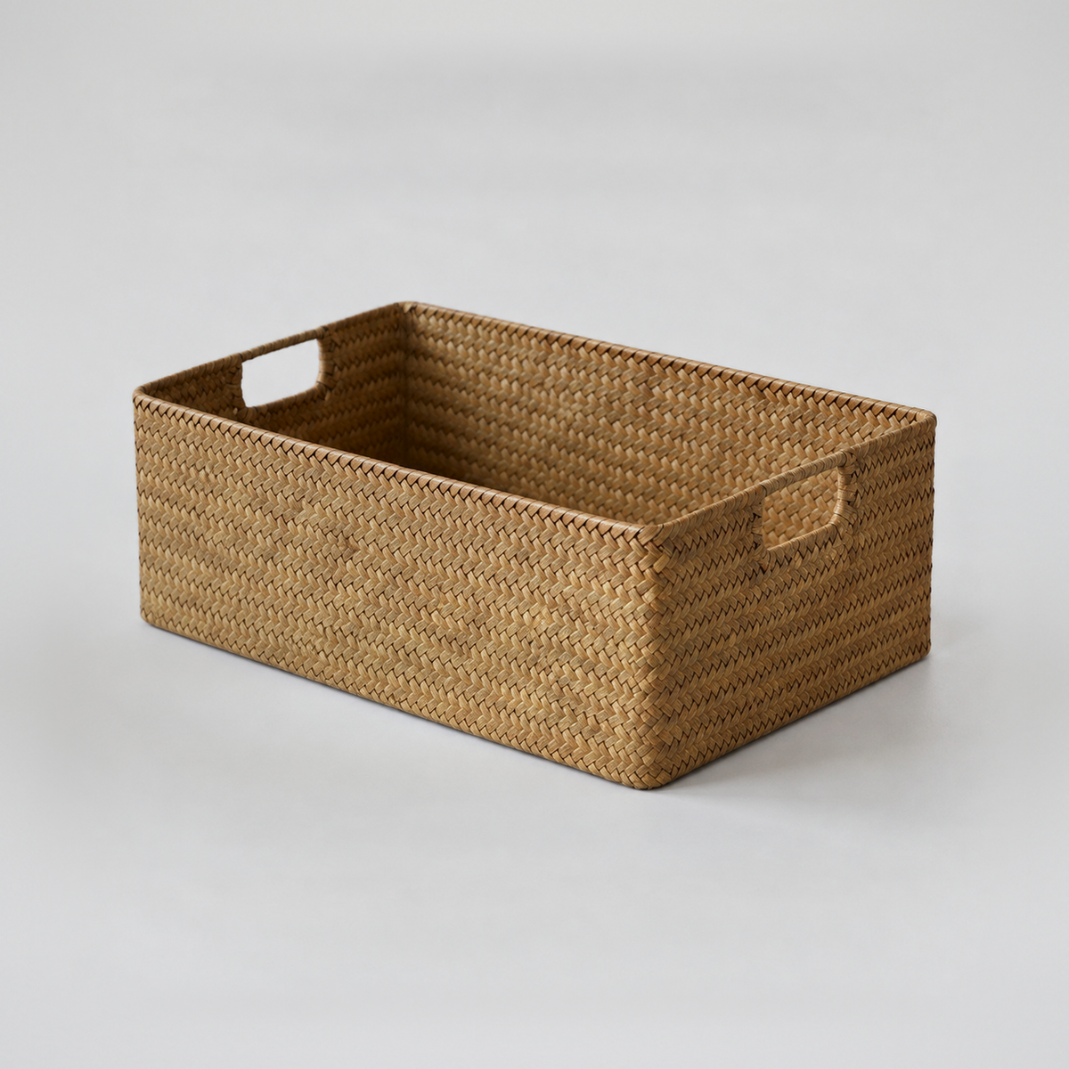 Small woven seagrass storage basket, 13.4 x 9.1 x 4.3 inches, empty on a plain light grey background