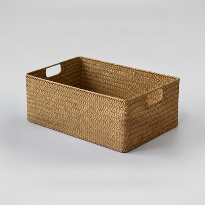 Medium woven seagrass storage basket, 14.6 x 10.2 x 4.7 inches, empty on a plain light grey background