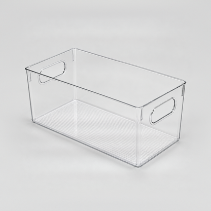 One empty clear open-top storage bin with a handle cut-out in each short end, on a light grey background