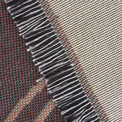 A close view of the black and white fringe between the off-white face and the darker reverse.