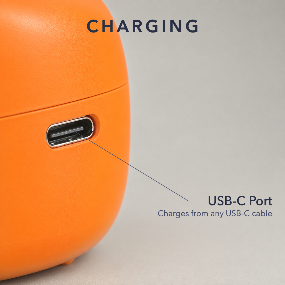 Close-up of the pumpkin lantern's USB-C charging port in its orange shell