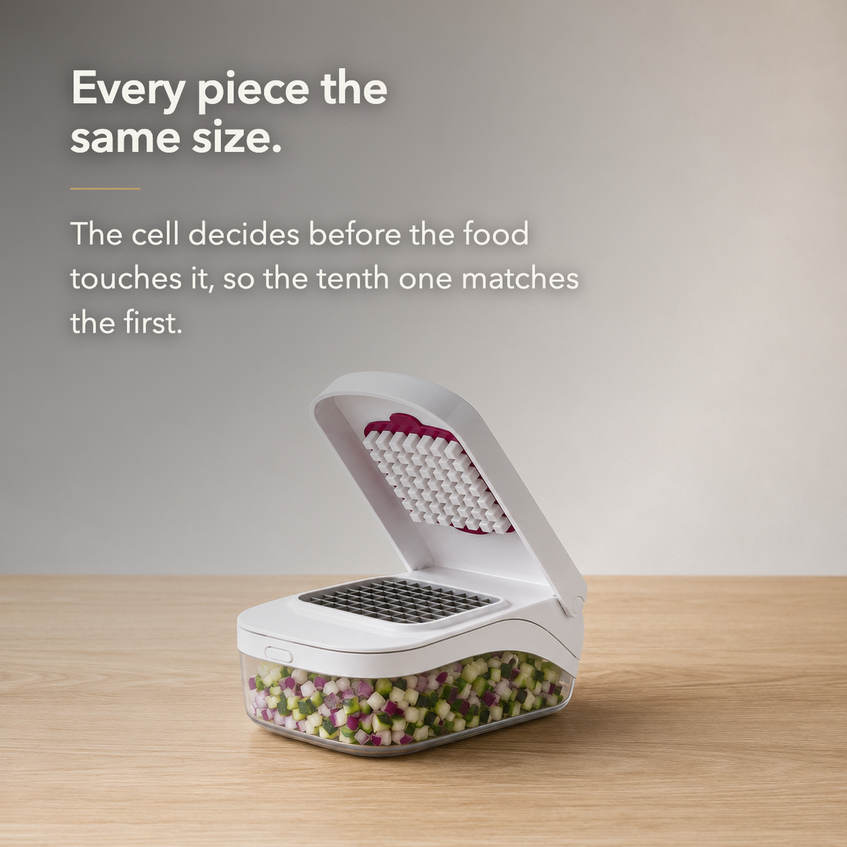 Text card reading Every piece the same size, beside the white vegetable chopper open on a wood worktop with diced vegetables in the clear container.