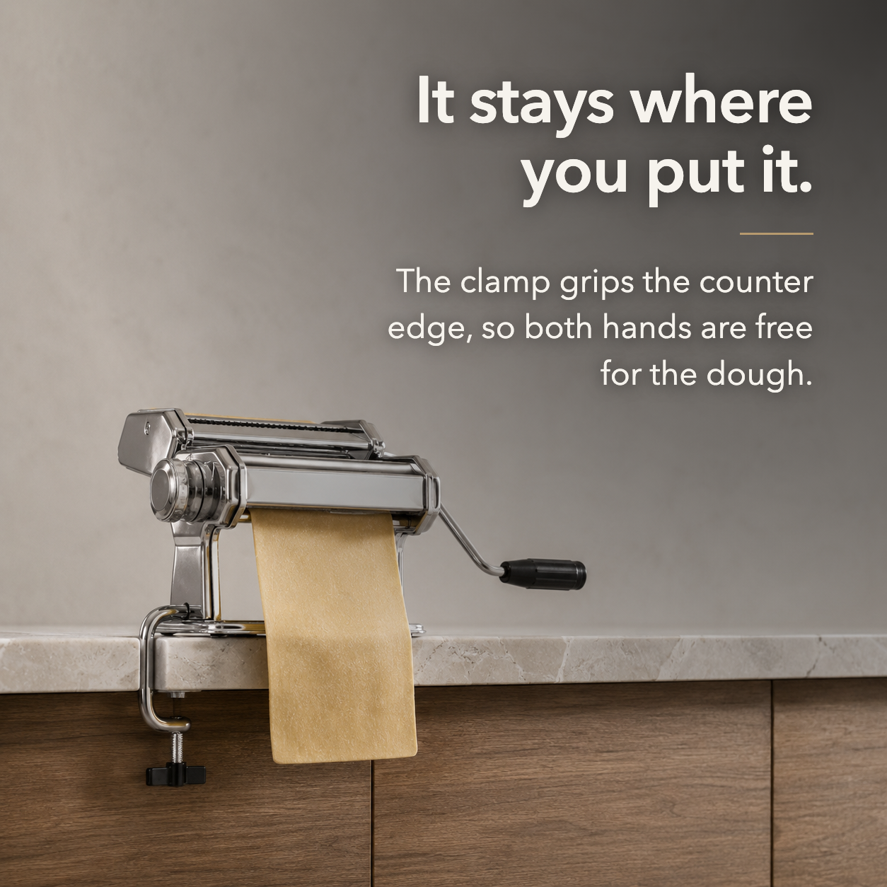 It stays where you put it: the bench clamp gripping the counter edge so both hands are free