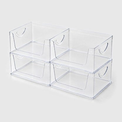 Set of four empty clear open-front pantry bins stacked two by two on a light grey background