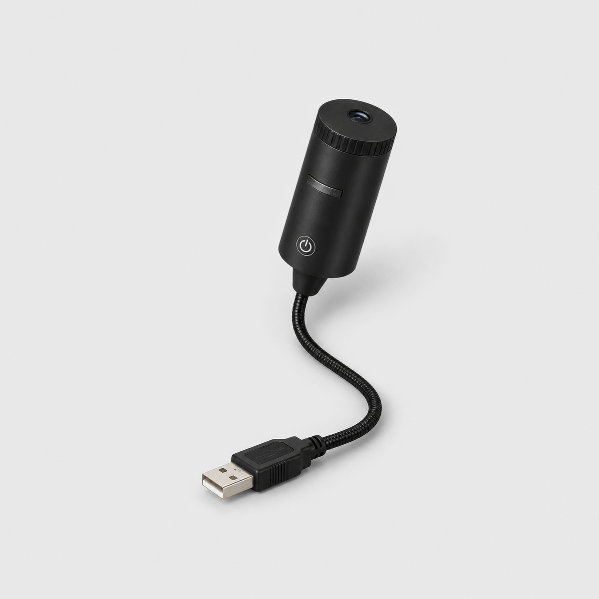 Christmas projector light on a gray background: a small black cylinder head with a ribbed top ring and power button on a flexible gooseneck ending in a USB plug