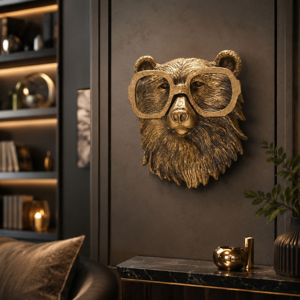 Bear head wall sculpture with glasses hung in a dark living room beside lit shelves