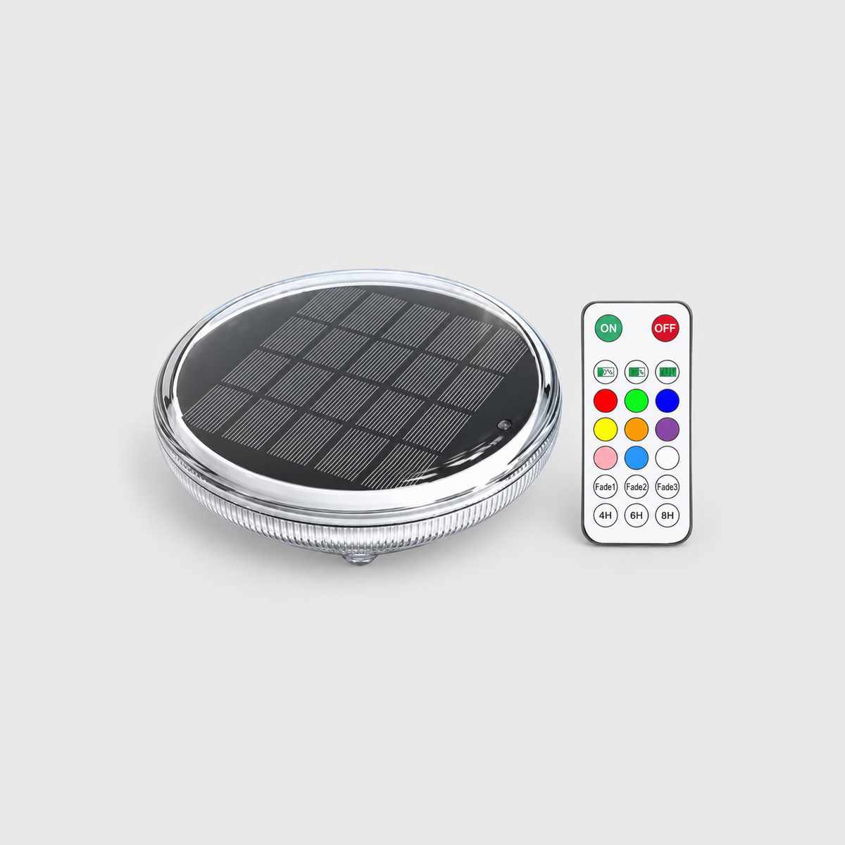 Solar floating pool light with its remote control on a light gray background