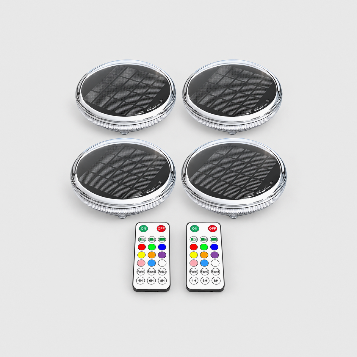 Four solar floating pool lights and two remote controls on a light gray background