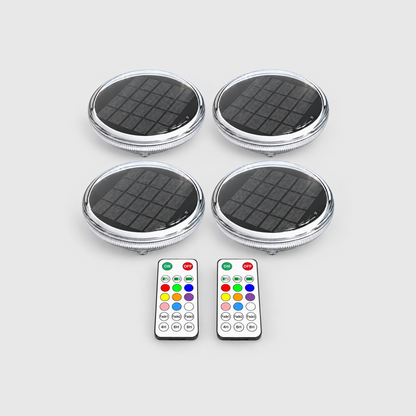 Four solar floating pool lights and two remote controls on a light gray background