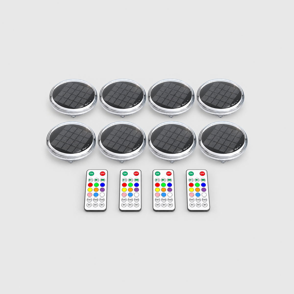 Eight solar floating pool lights and four remote controls on a light gray background