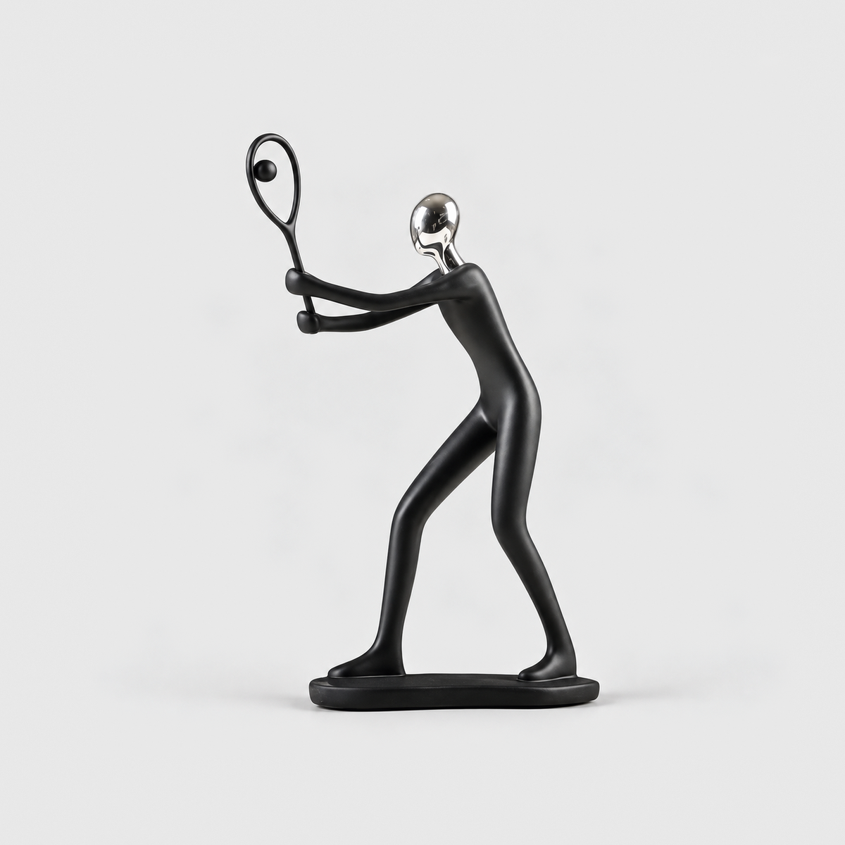 A matte black tennis player sculpture holding an open racket frame, on a light gray background