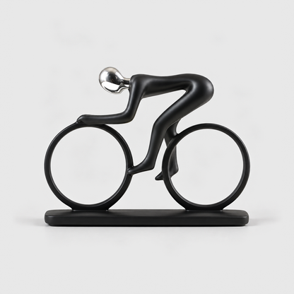 A matte black cyclist sculpture crouched over a bicycle made of two open rings, on a light gray background