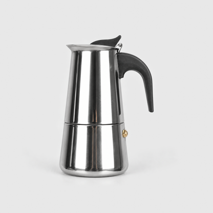 Polished stainless steel moka pot, 6 cup size, on a light gray background