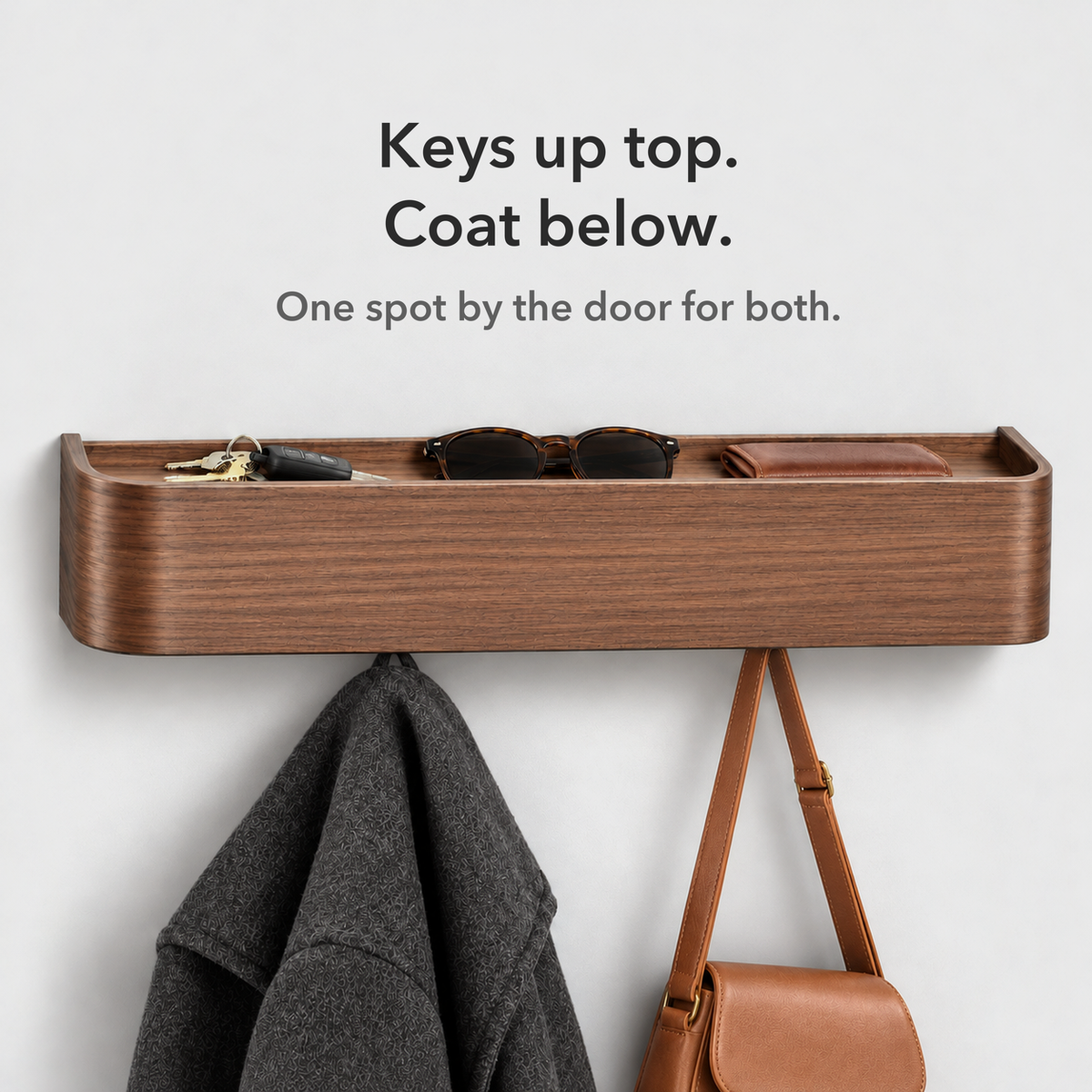 Walnut coat rack with keys and sunglasses on the shelf and a coat and bag on the hooks, card reading Keys up top, coat below