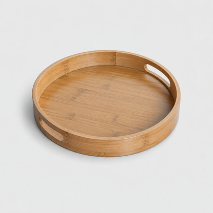 Extra large round bamboo serving tray with two cut-out handles, on a light gray background
